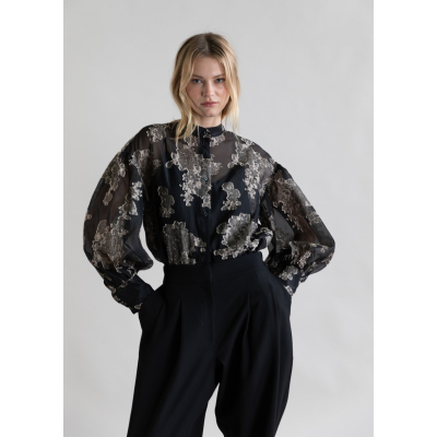 Blouse with beige floral print